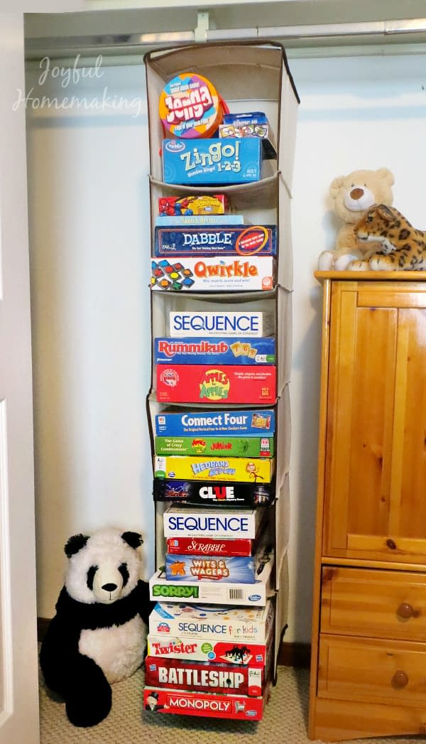 Boxes of board games and puzzles for toy storage ideas by GinGin & Roo